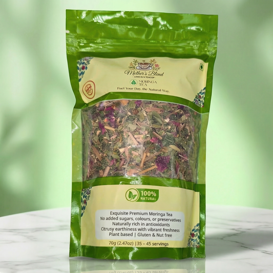 Packaged Moringa tea of 'Mothers Blend' with green and white label on a light green background